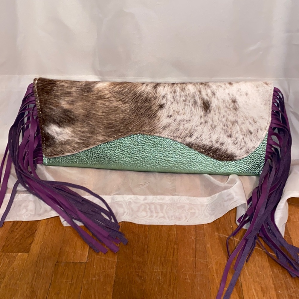New Cowhide clutch with purple fringe.